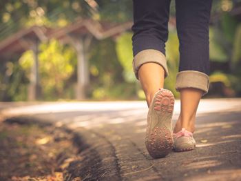 A woman walking down a road